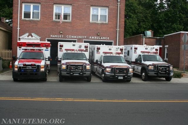 All 4 trucks parked in front of the old building 
Photo: Nanuet EMS 